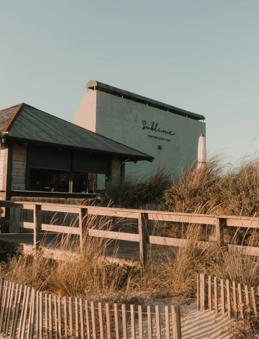 Sun-drenched spot for good food, refreshing drinks, music, and relaxed coastal vibes.